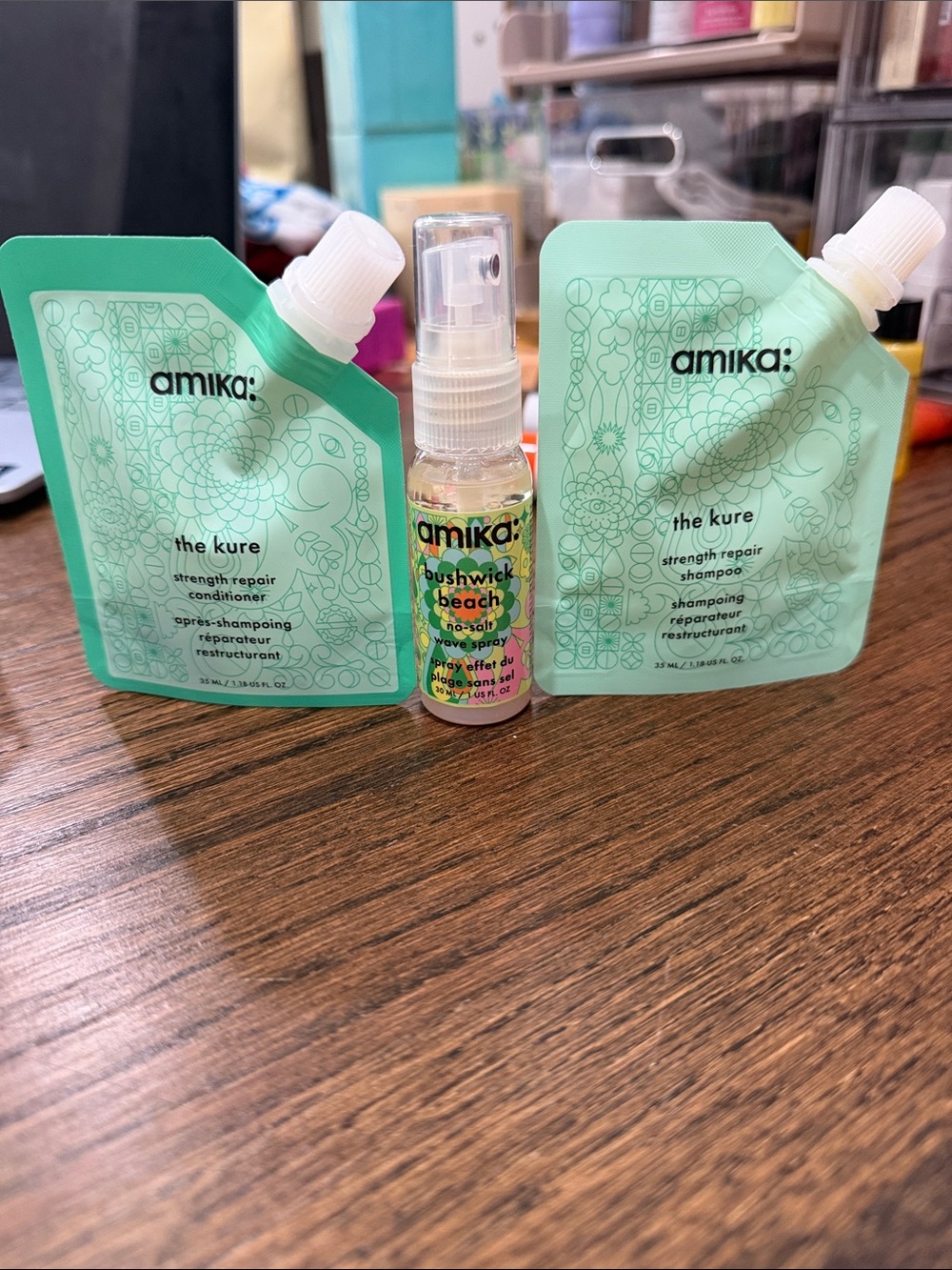 Amika the kure strength repair shampoo & conditioner pouch and beach wave spray